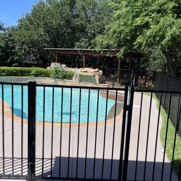 Secure your pool with professional Pool Fencing from Rockwall Outdoor Living. Custom aluminum, glass, and mesh solutions for safety and style.