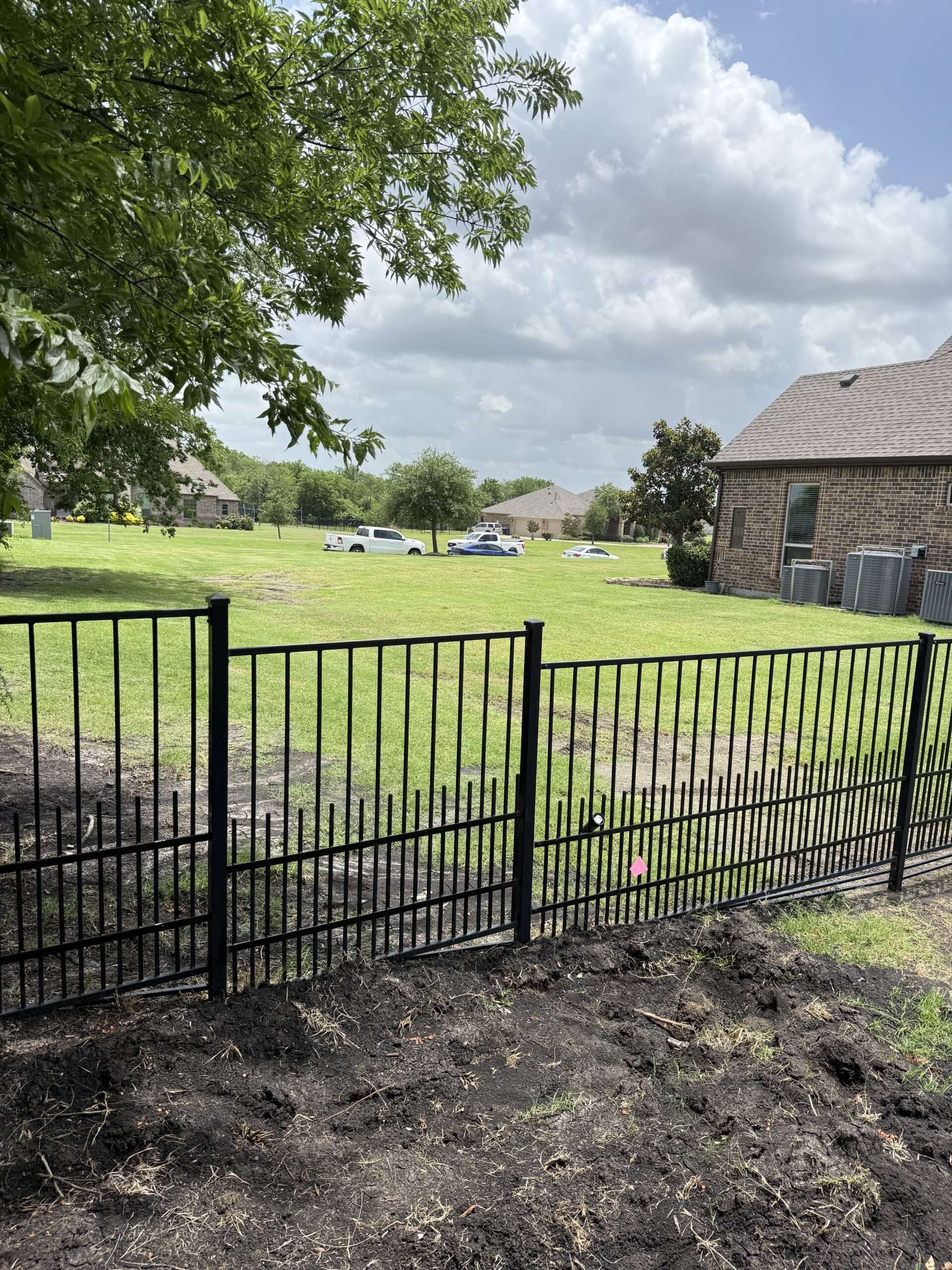 Custom black ornamental metal railing installed